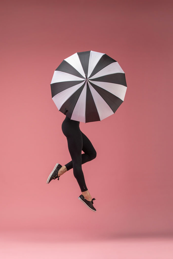 houston commercial photographer umbrella pink background